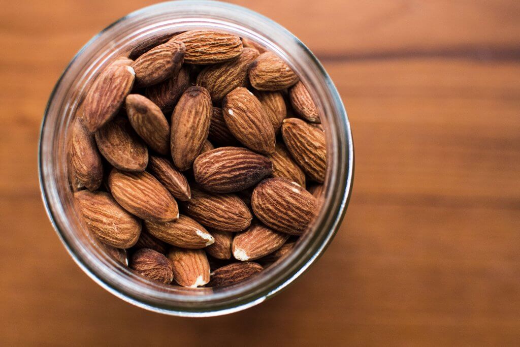 Keep healthy snacks jar on your desk with nuts and seeds mix. 